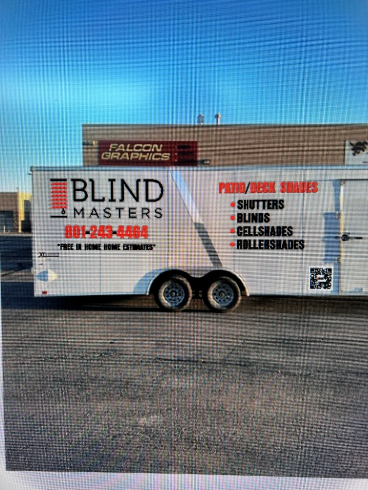 Blind Masters enclosed trailer with printed advertising graphics