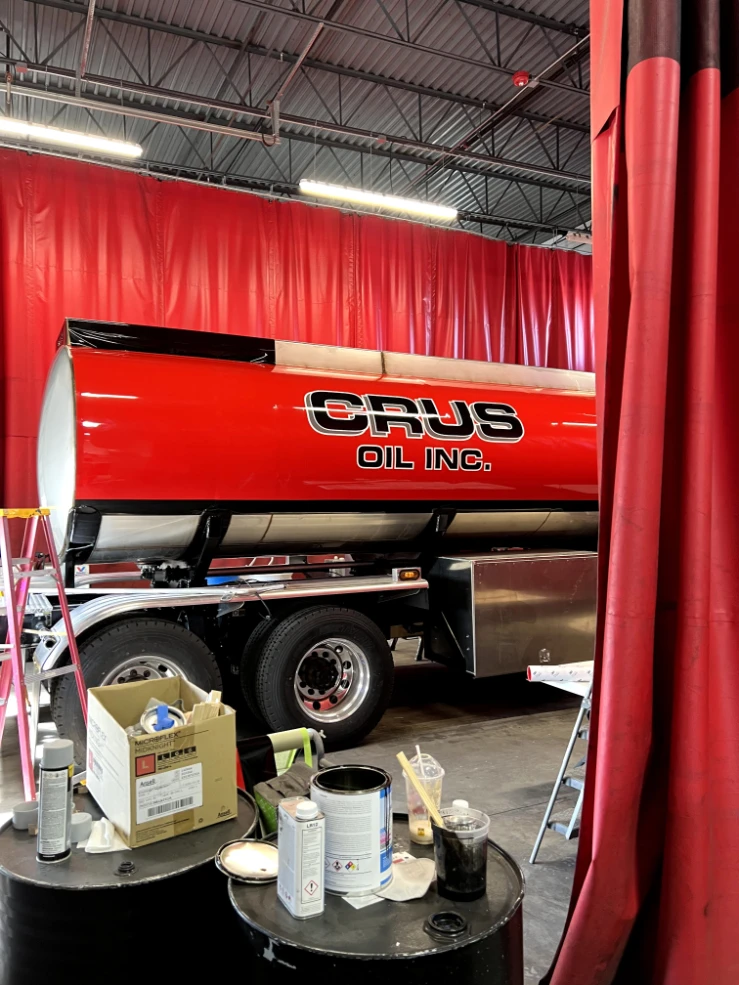 Crus Oil, Inc. tank lettering inside the shop