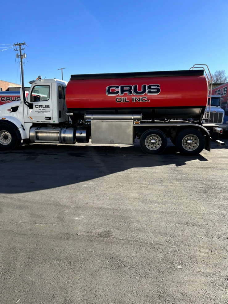Crus Oil, Inc. fuel tanker truck with red tank graphics by Falcon Graphics