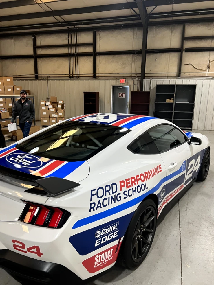 Ford Performance Racing School Mustang number 24 with red, white, and blue livery