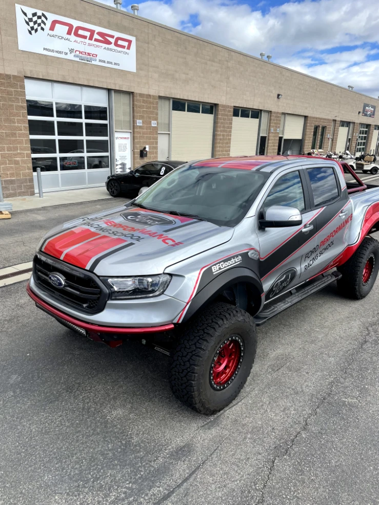 Silver Ford Ranger with red and black race wrap